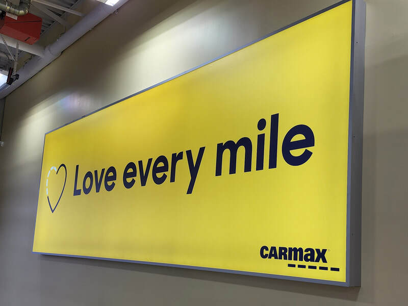 CarMax vehicle delivery area lightbox. Love every mile.