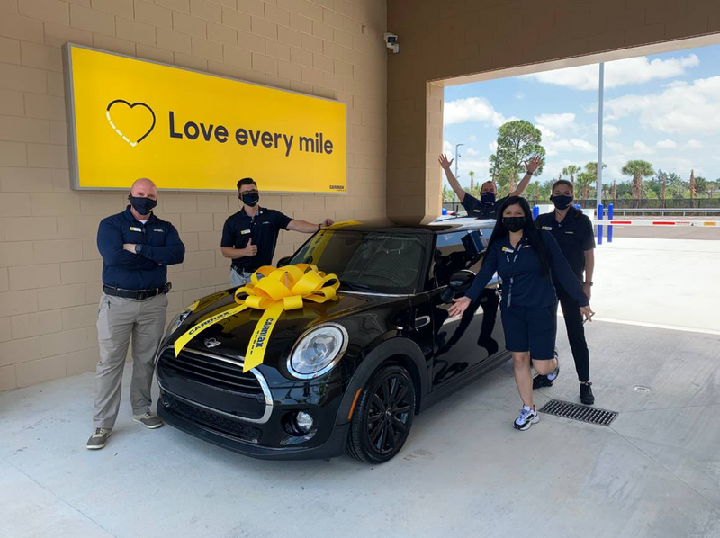 CarMax vehicle delivery area lightbox. Love every mile.